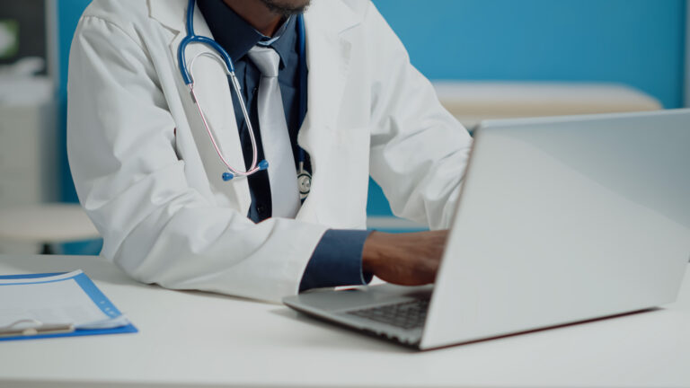 close-up-of-doctor-typing-on-laptop-keyboard-in-me-2023-11-27-05-25-33-utc_qohnt3-R9FlGX