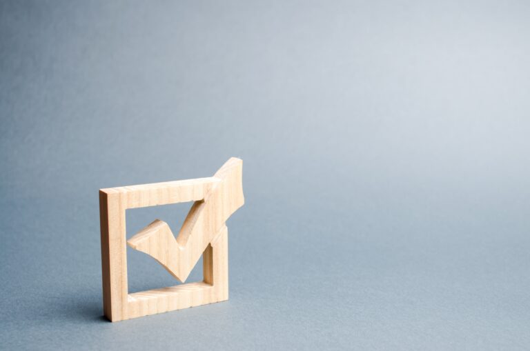 wooden-checkmark-for-voting-on-elections-on-a-gray-2023-11-27-05-12-07-utc_oghwcg-2XaRH9