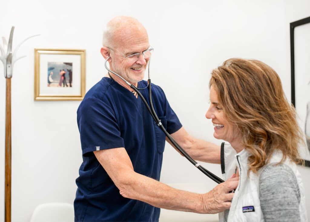 Doctor smiling while interacting with patient