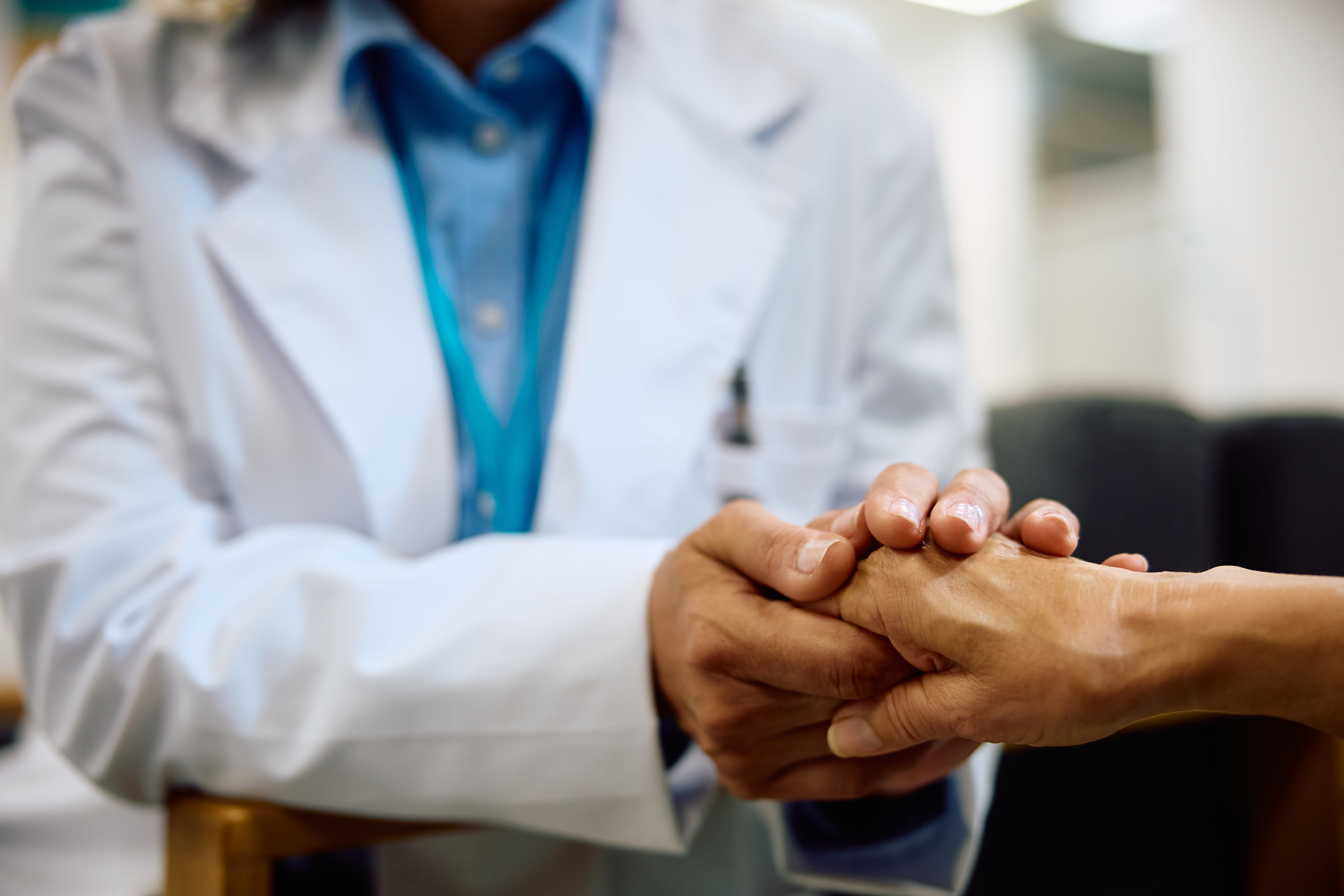 close-up-of-caring-doctor-holding-senior-woman-s-h-2023-12-12-20-21-59-utc_yxytv2-A98Pu4