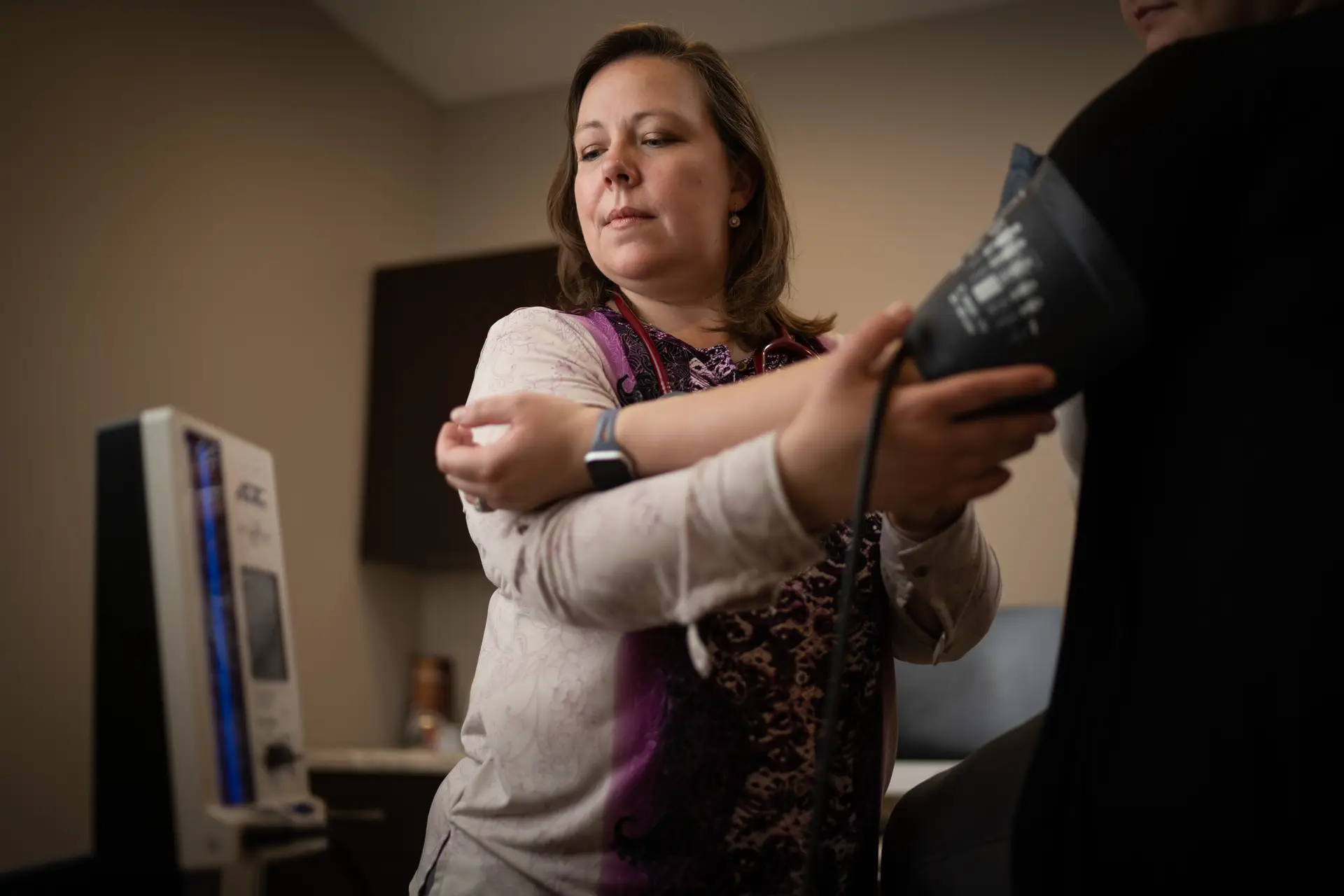 Doctor taking patient's pulse