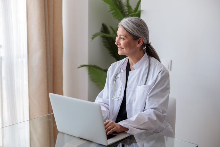 portrait-of-happy-mature-female-physician-working-2023-11-27-05-10-04-utc_ipaje3-JdmvGu