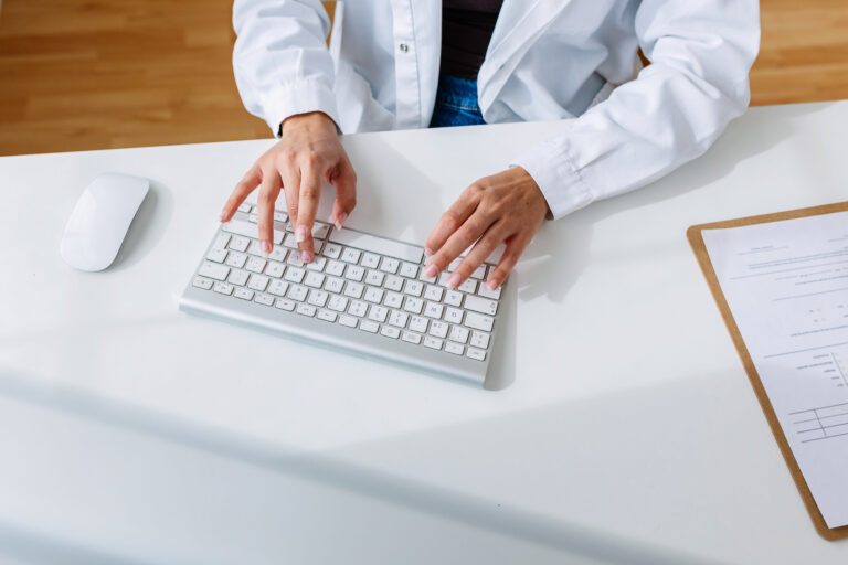 unrecognizable-female-doctor-working-on-laptop-at-2023-11-27-05-09-27-utc_ht5piw-OvJPtA