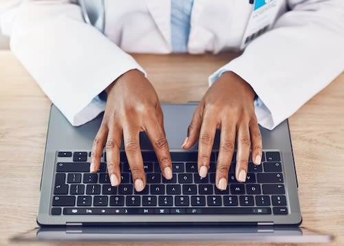 above-closeup-african-american-woman-doctor-using-2025-04-06-12-51-09-utc_vnkblg-3dtlzT