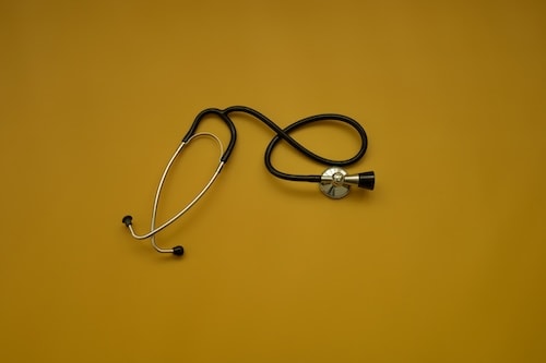 top-shot-of-stethoscope-on-ocher-background-heal-2025-03-10-09-53-28-utc_xx6xxo-i6H3DM