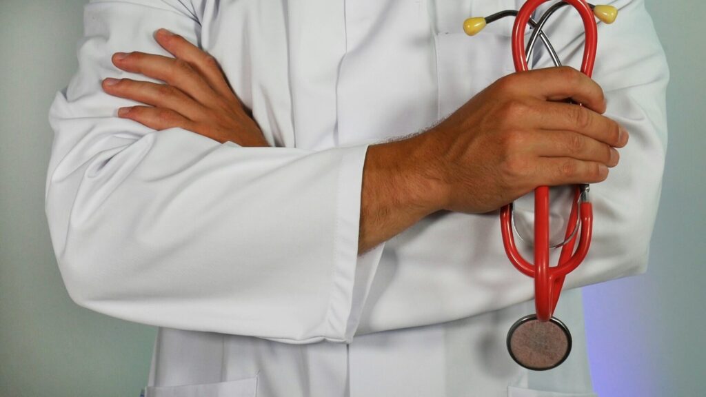 Doctor crossing their arms holding a stethoscope