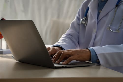 a-male-doctor-sits-at-a-desk-in-heart-clinic-cons-2025-02-15-06-33-31-utc_sfu08t-8zDV3A