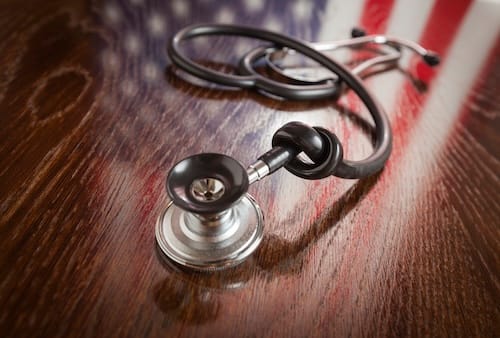 knotted-stethoscope-with-american-flag-reflection-2024-09-11-10-29-18-utc_a1igey-GgP3FK