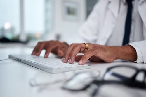 hands-keyboard-and-doctor-typing-at-desk-for-rese-2025-04-05-14-05-17-utc_wutkkf-IT7j52