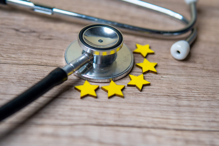 closeup-image-of-stethoscope-and-five-stars-on-woo-2026-01-09-06-50-55-utc_nadbgv-Bn7FxL