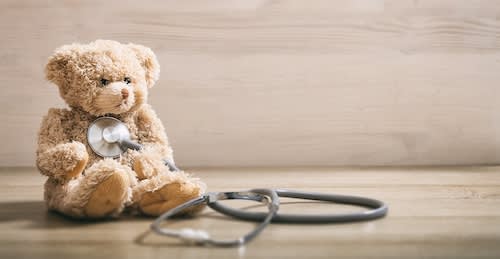 teddy-bear-and-a-stethoscope-on-a-wooden-floor-2026-03-16-00-46-41-utc_xedzgt-uIRl1U