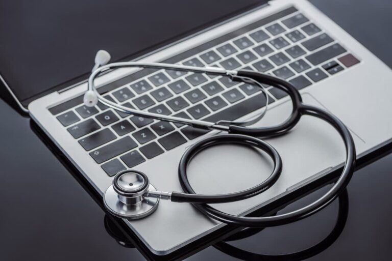 selective-focus-of-stethoscope-and-laptop-on-glass-2023-11-27-04-53-39-utc_1_a8sush-RCTG9E